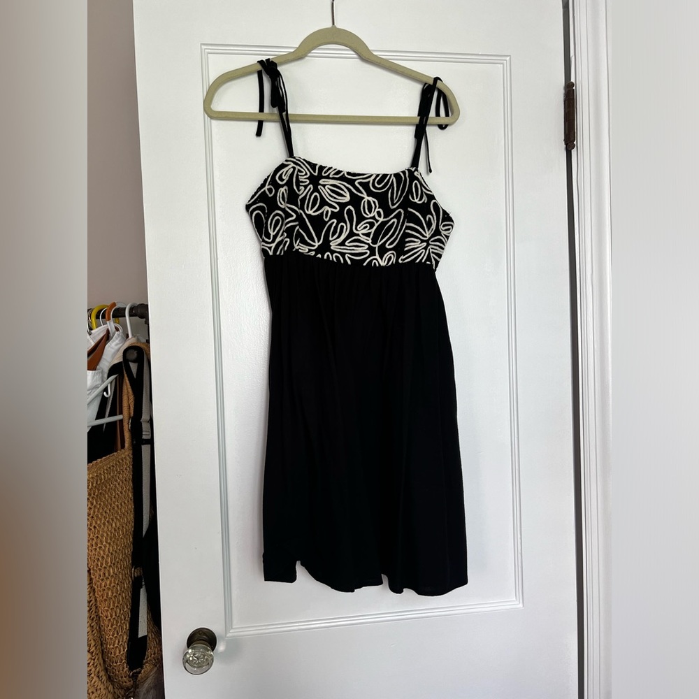 Short black dress with floral detail
